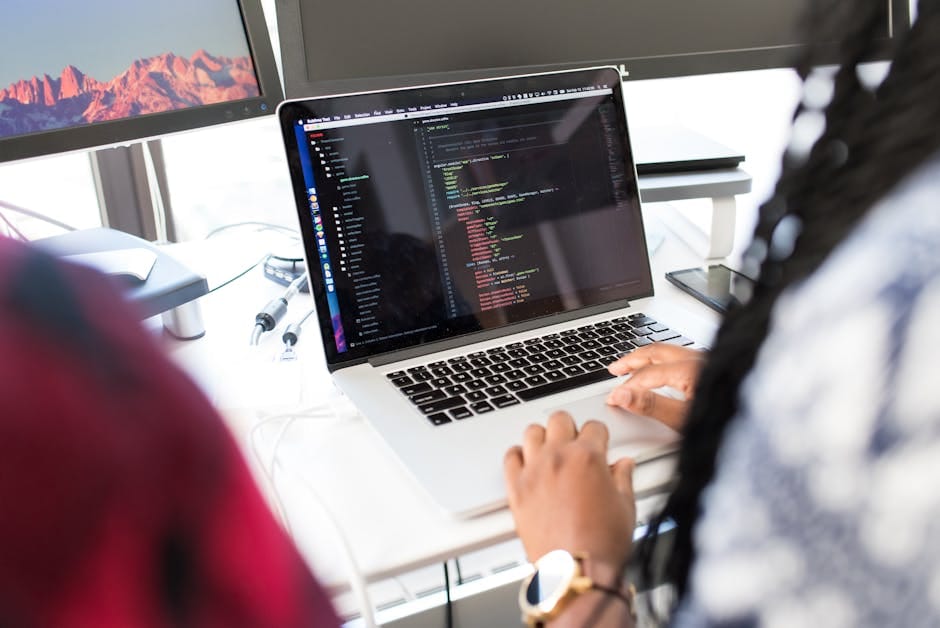 A modern workspace with a developer using the Fetch API on a sleek computer setup