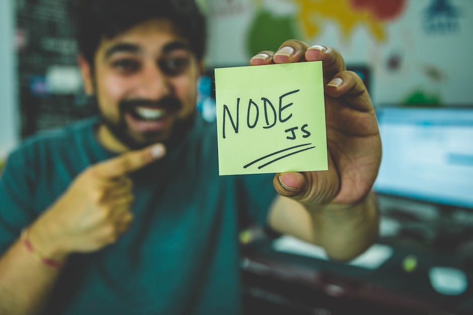 A person's hands coding on a laptop keyboard, symbolizing the integration of Node.js and HTML in web development